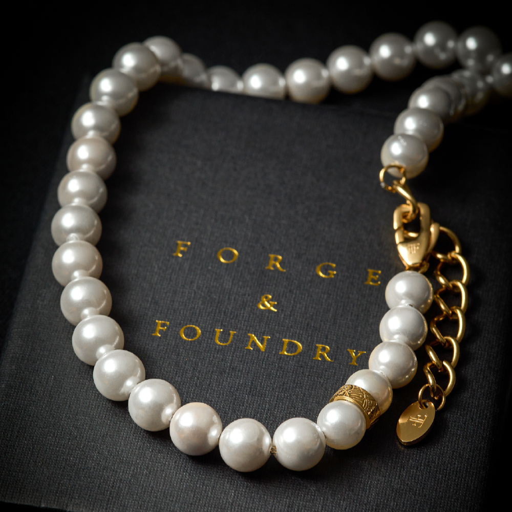 mens shell pearl necklace on packaging box