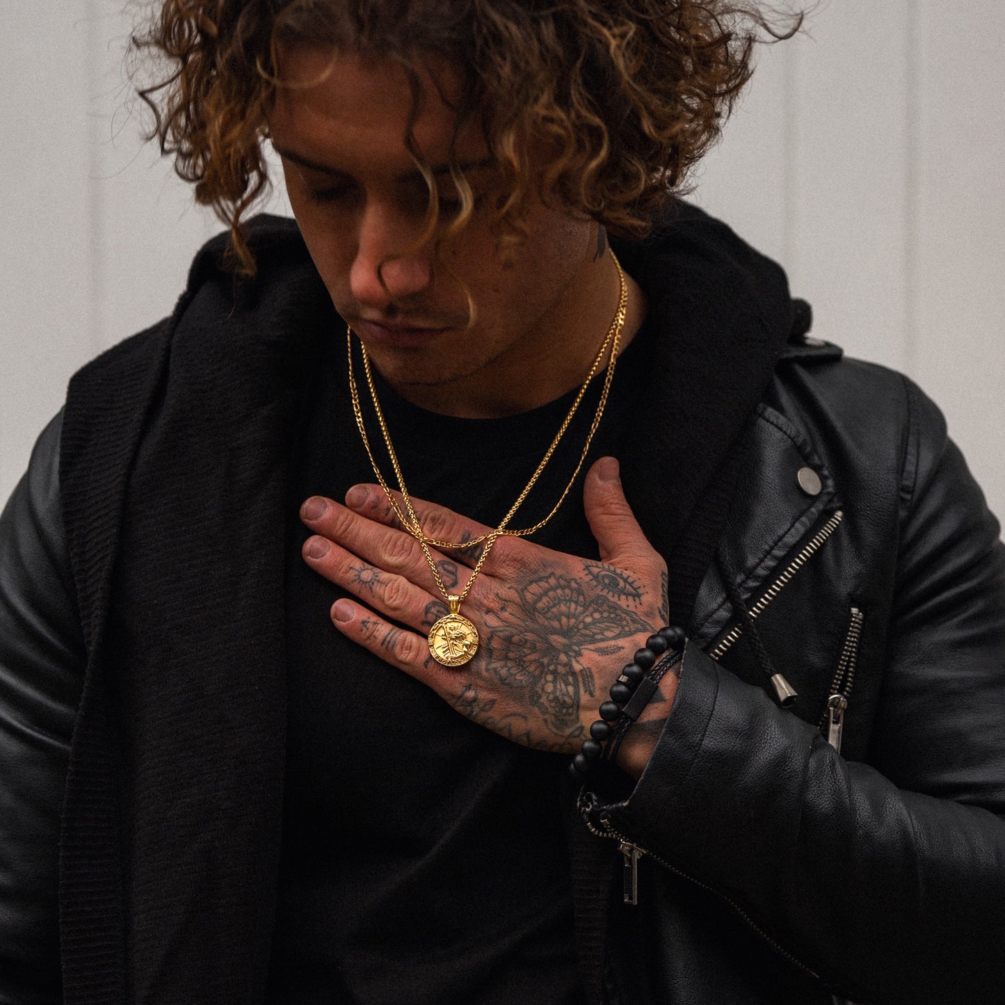 Mens gold saint Michael pendant on model