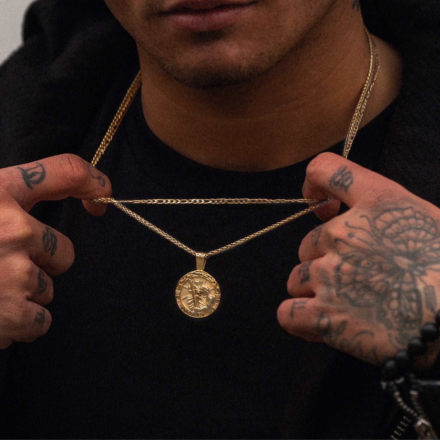 Mens gold saint Michael pendant on model