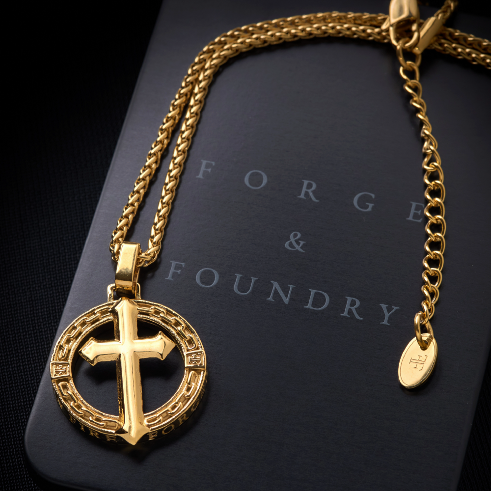 Mens gold plated cross pendant on tin packaging