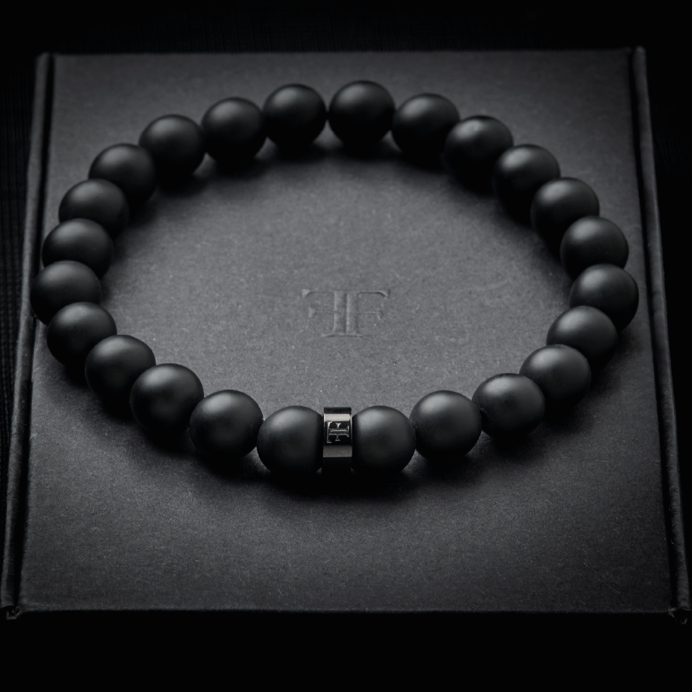 mens 8mm all black beaded stone bracelet on packaging