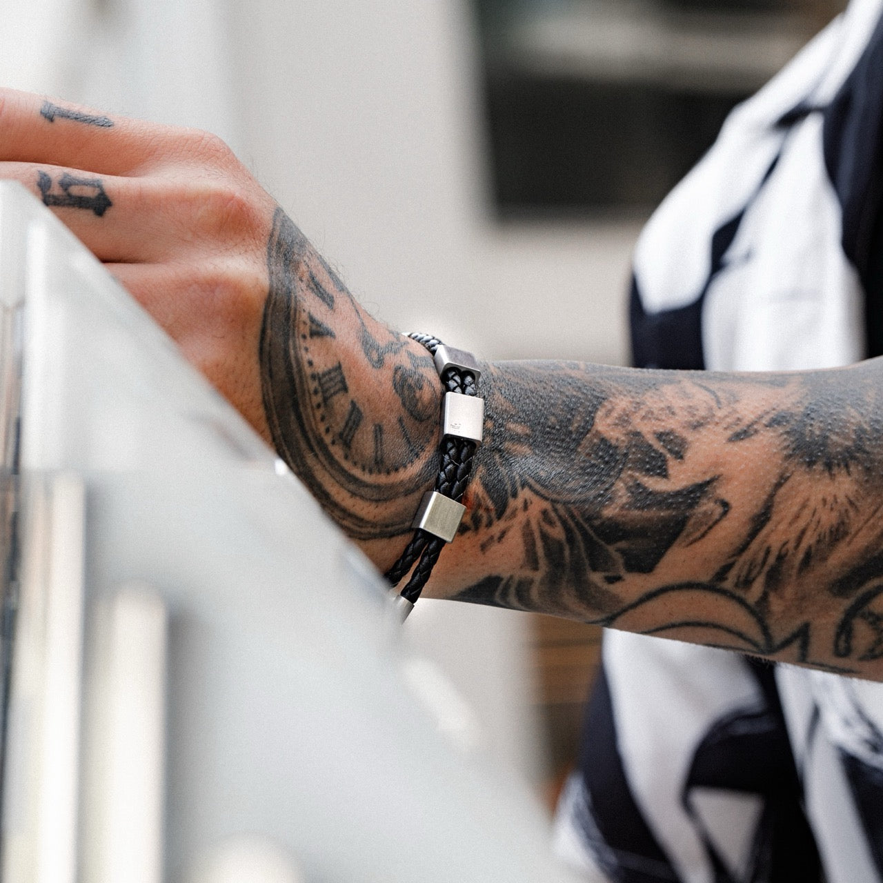Men's leather and steel adjustable bracelet on model