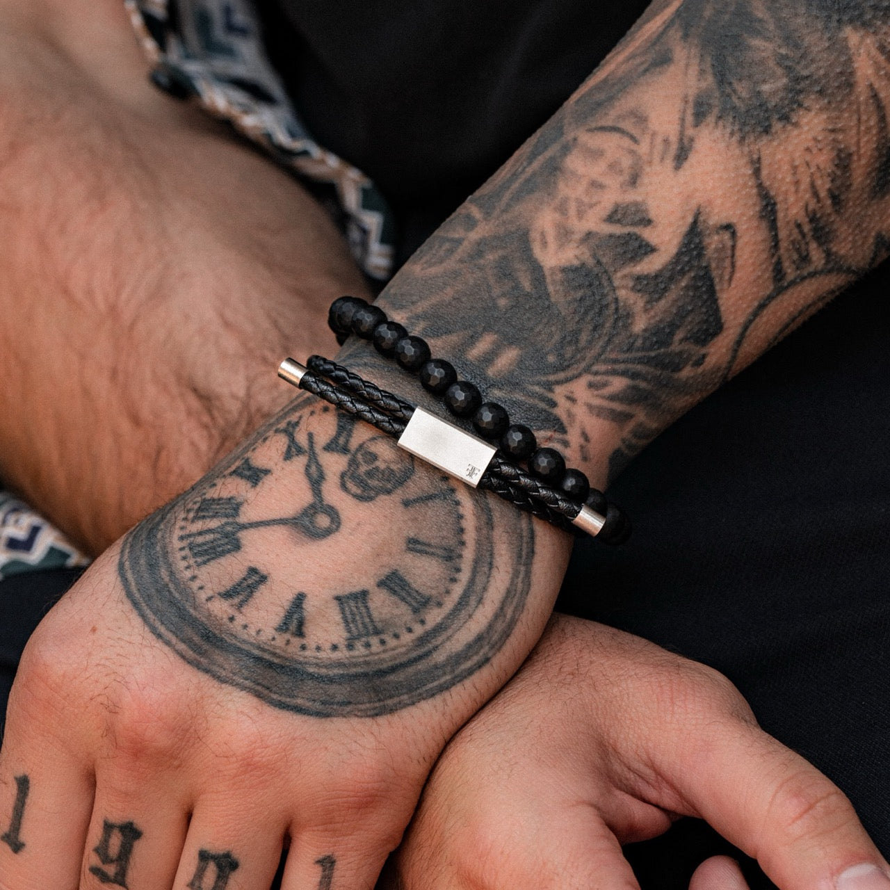 Men's leather and steel adjustable bracelet on model