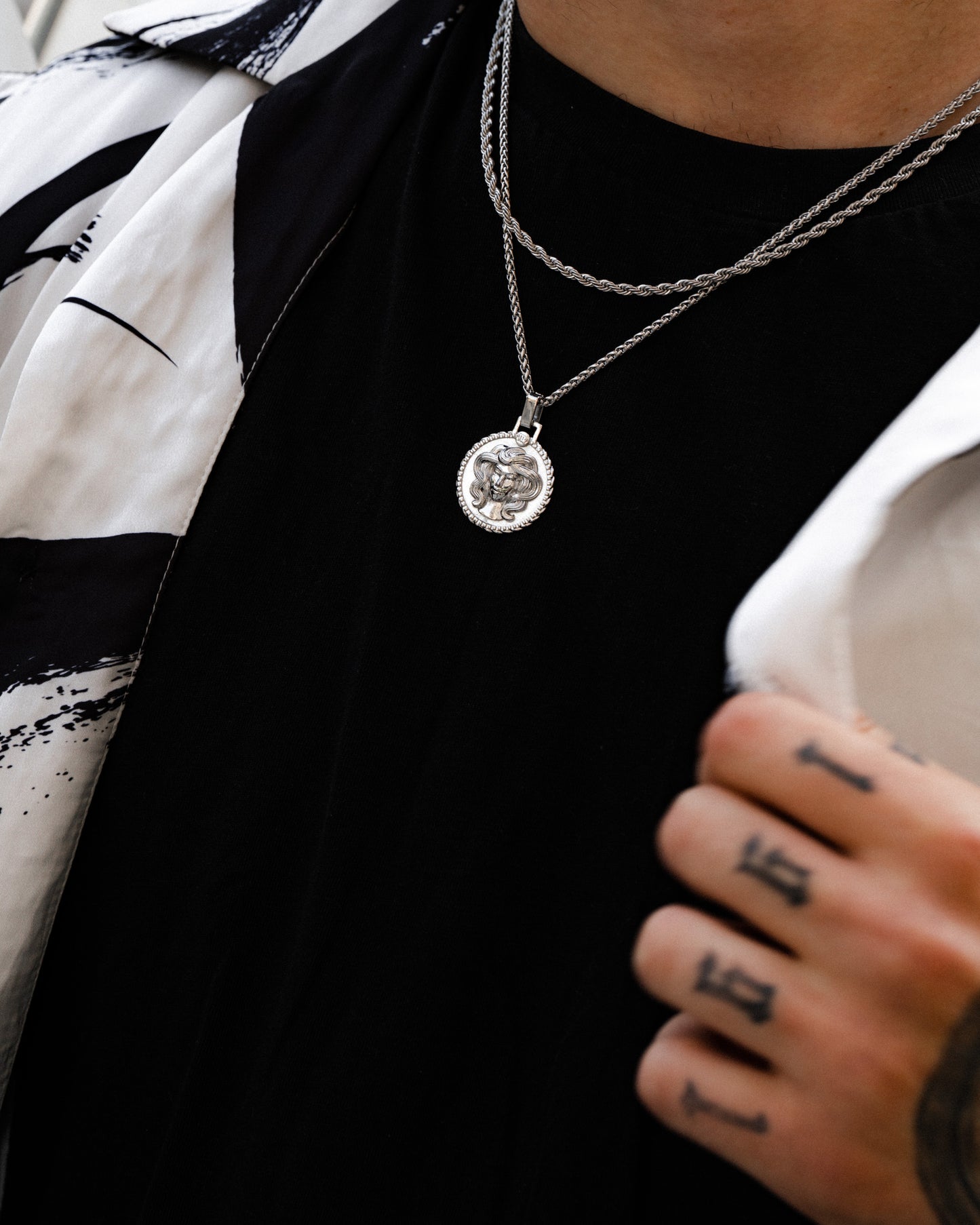 Men's silver Virgo pendant necklace on model