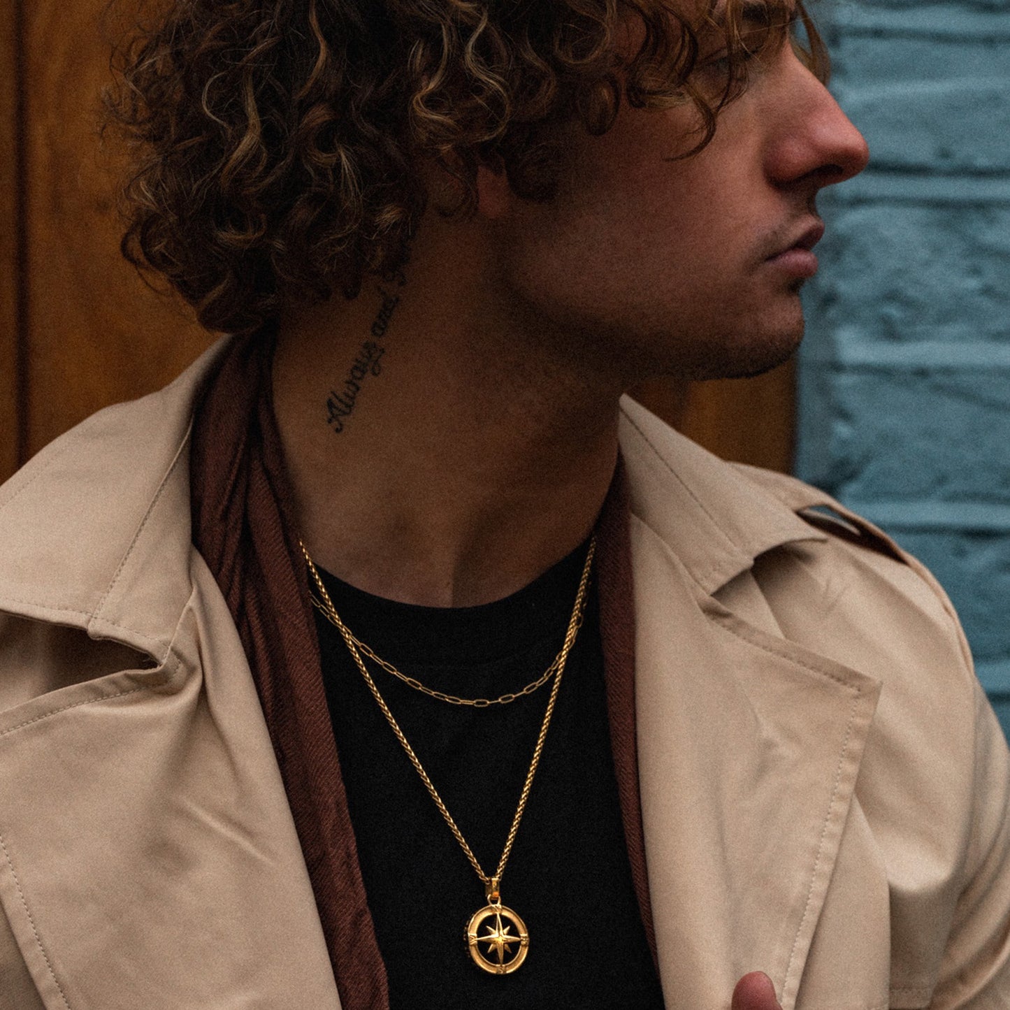 Men's gold North Star pendant necklace on model