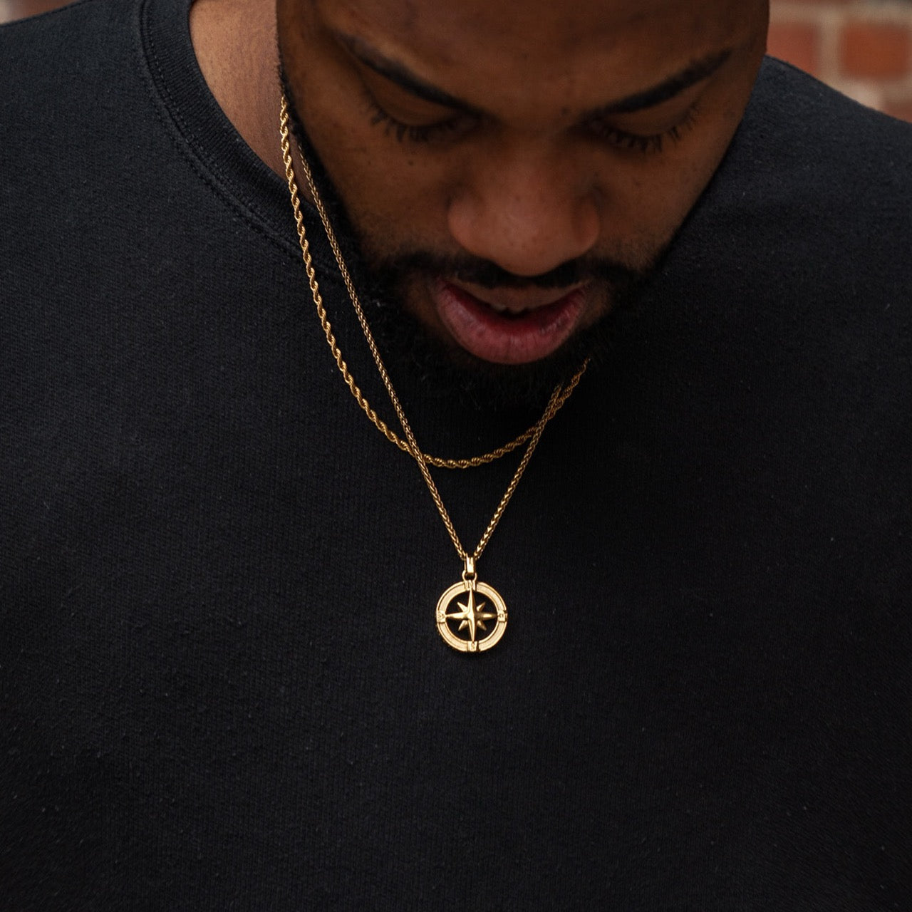 Men's gold North Star pendant and rope layering chain necklace on model