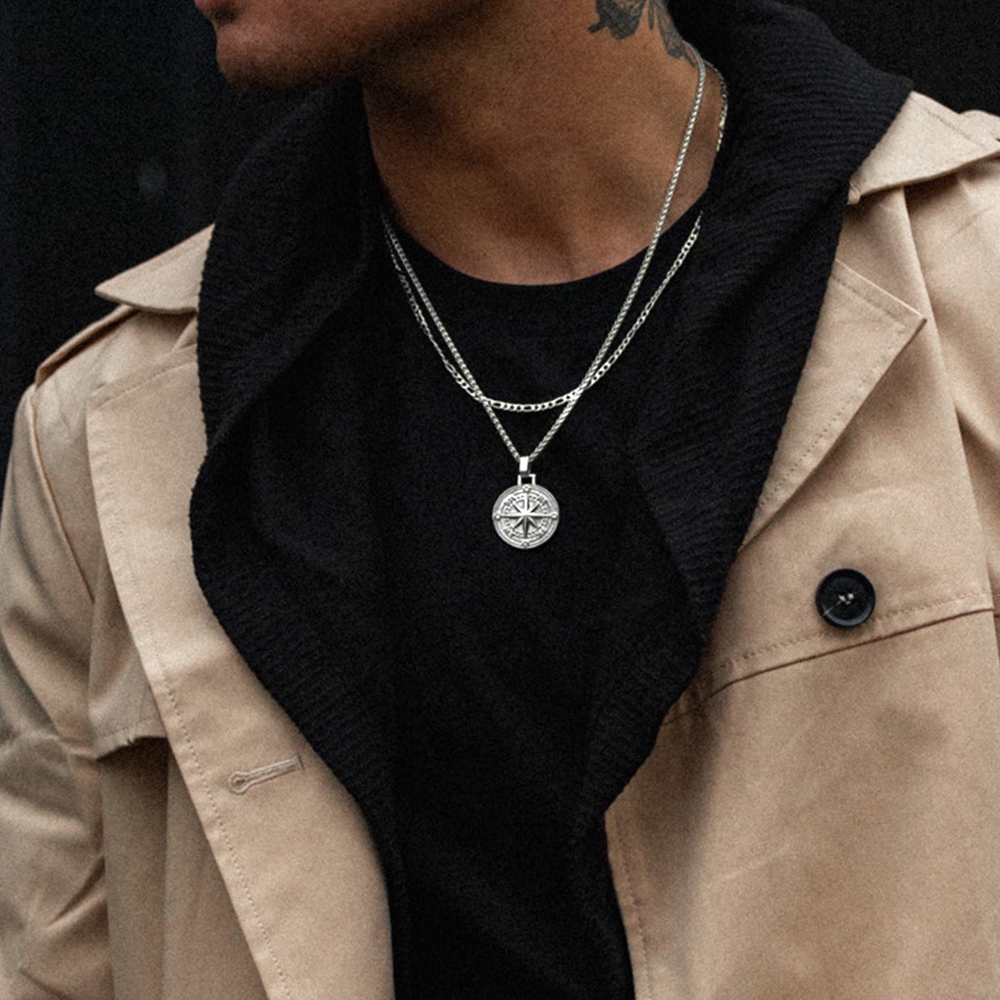 Men's silver compass pendant necklace on model