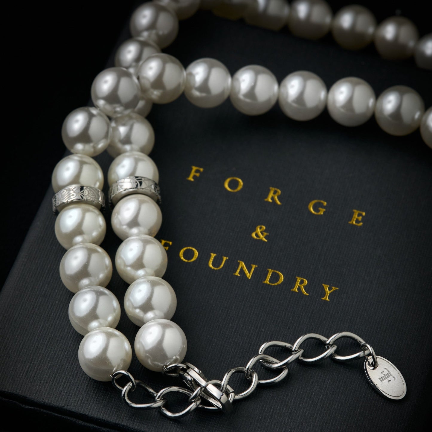 Mens shell pearl necklace with silver clasp on packaging