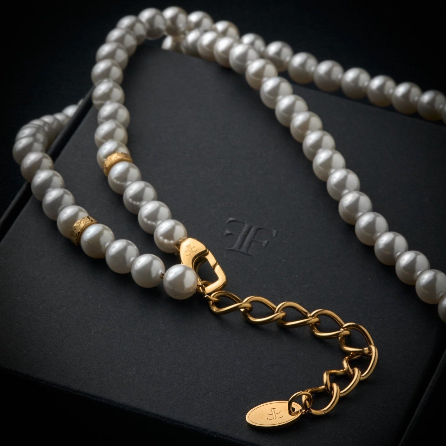 mens pearl necklace with gold beads on packaging