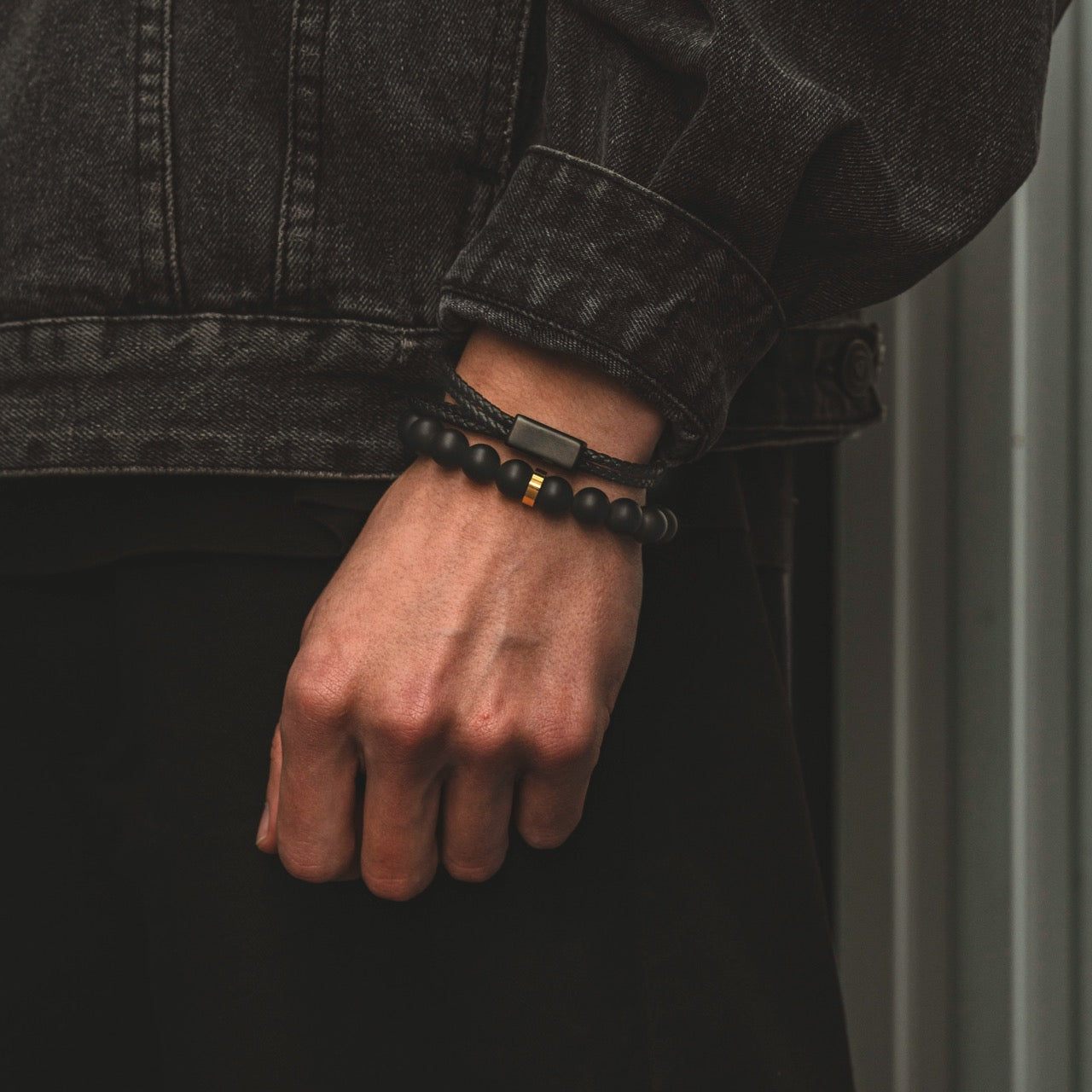 Mens gold and black onyx bead and stone bracelet on model