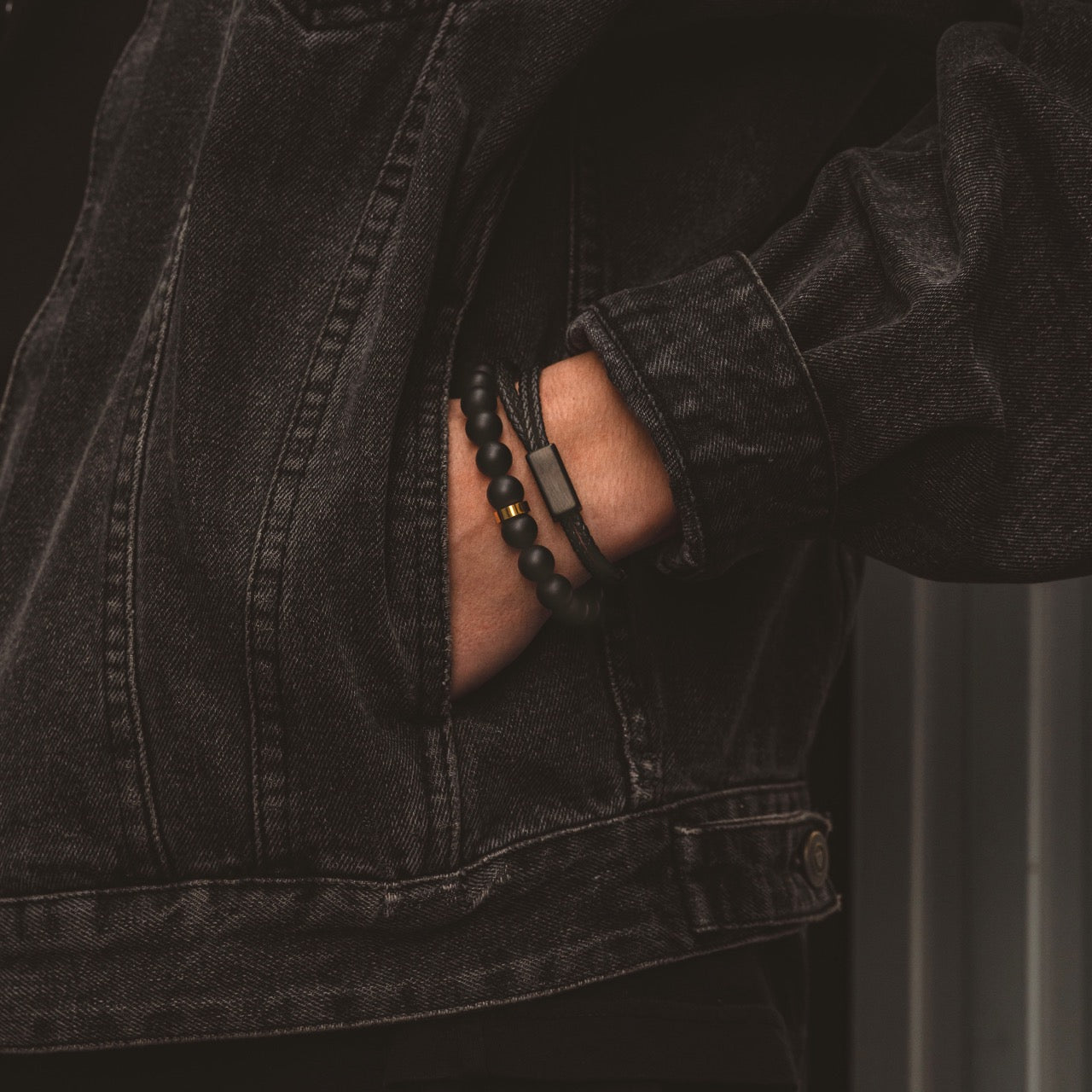 black adjustable leather bracelet on model