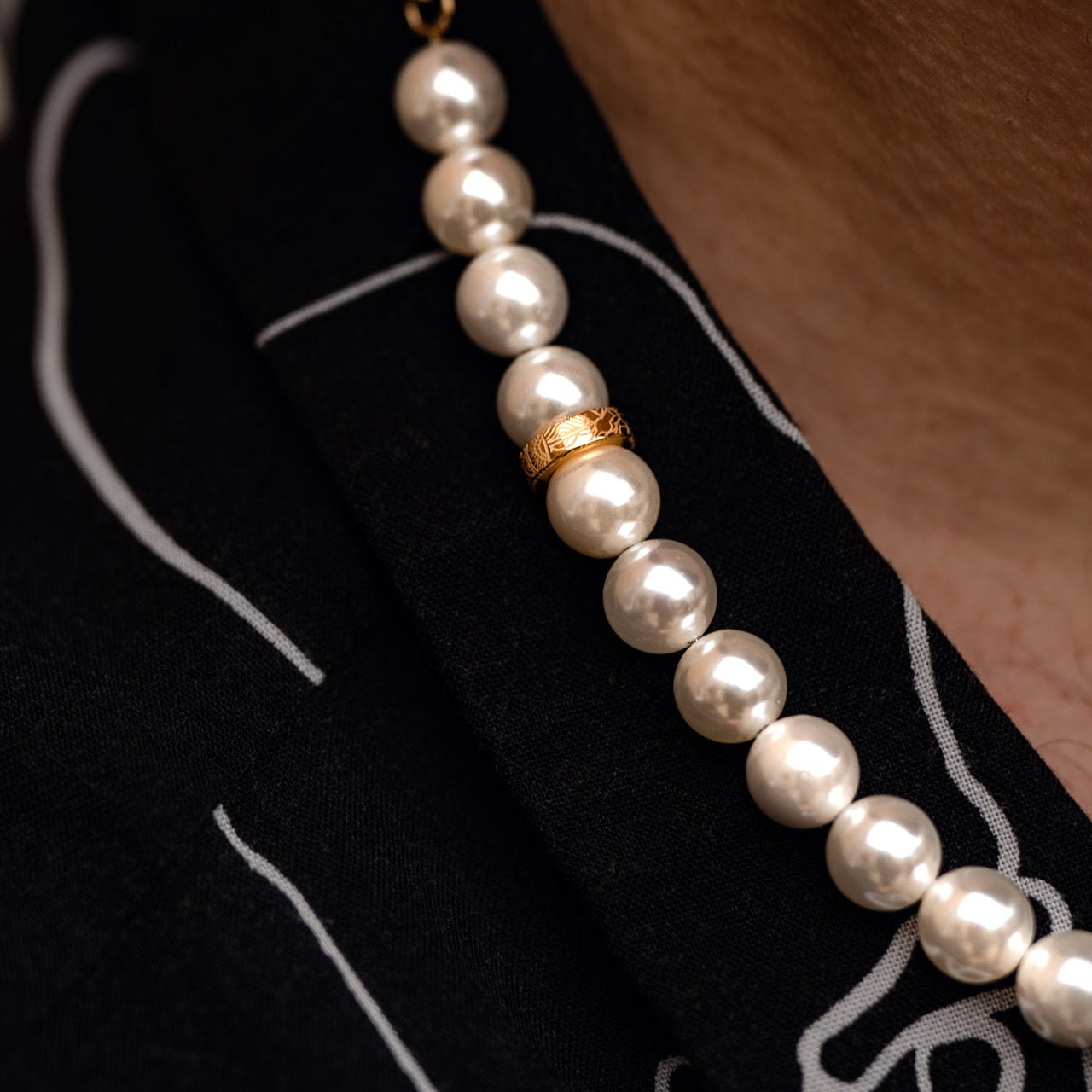 Mens shell pearl necklace with gold clasp on model