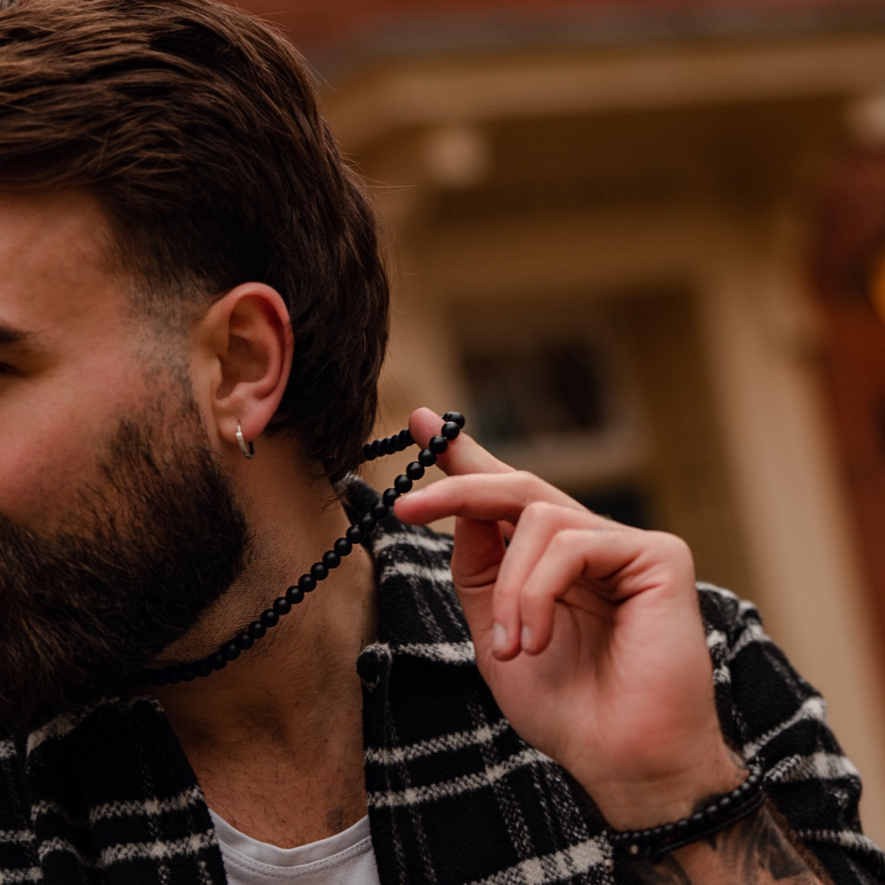 Men's black onyx 8mm bead necklace on model