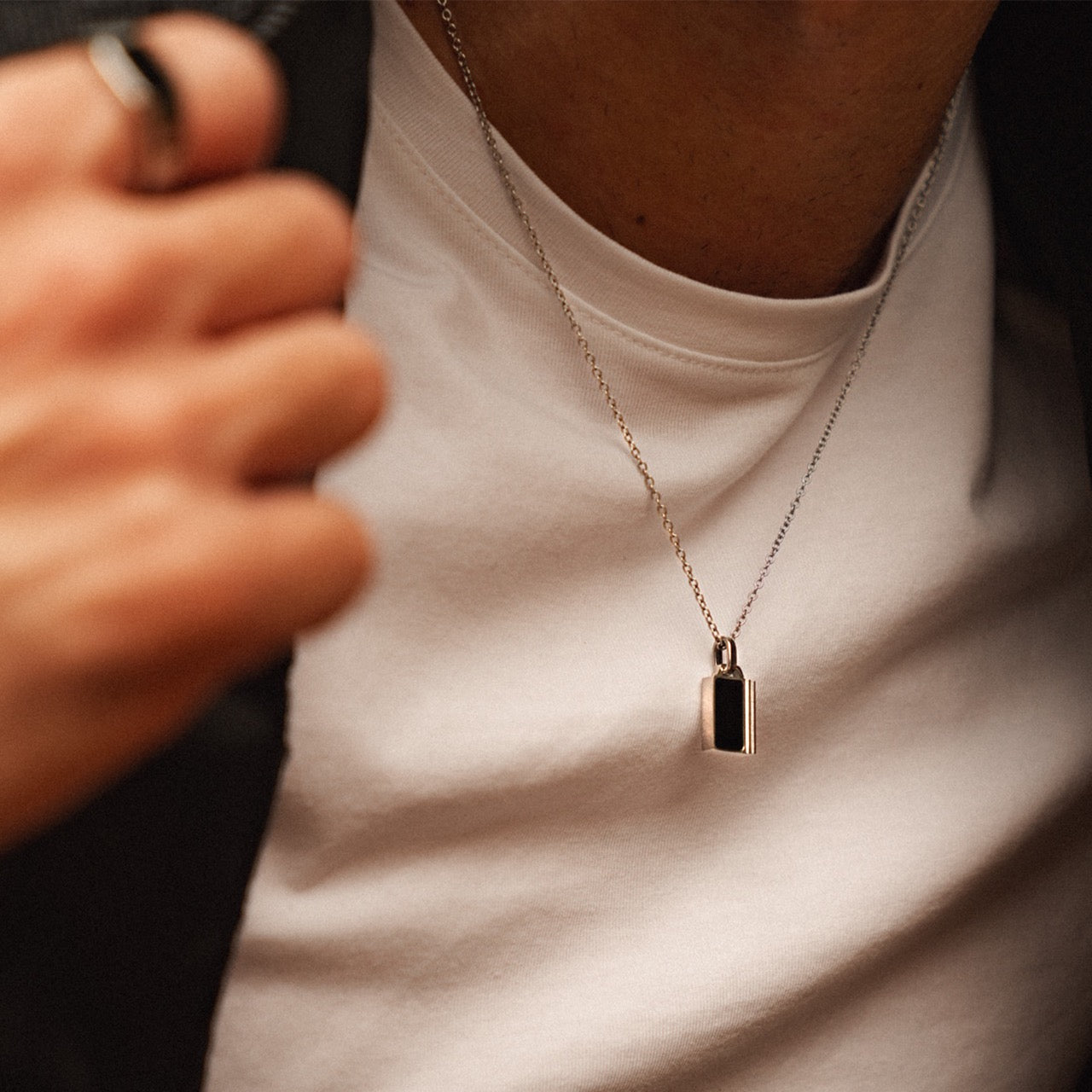 Men's minimalist silver onyx inlay pendant necklace on model