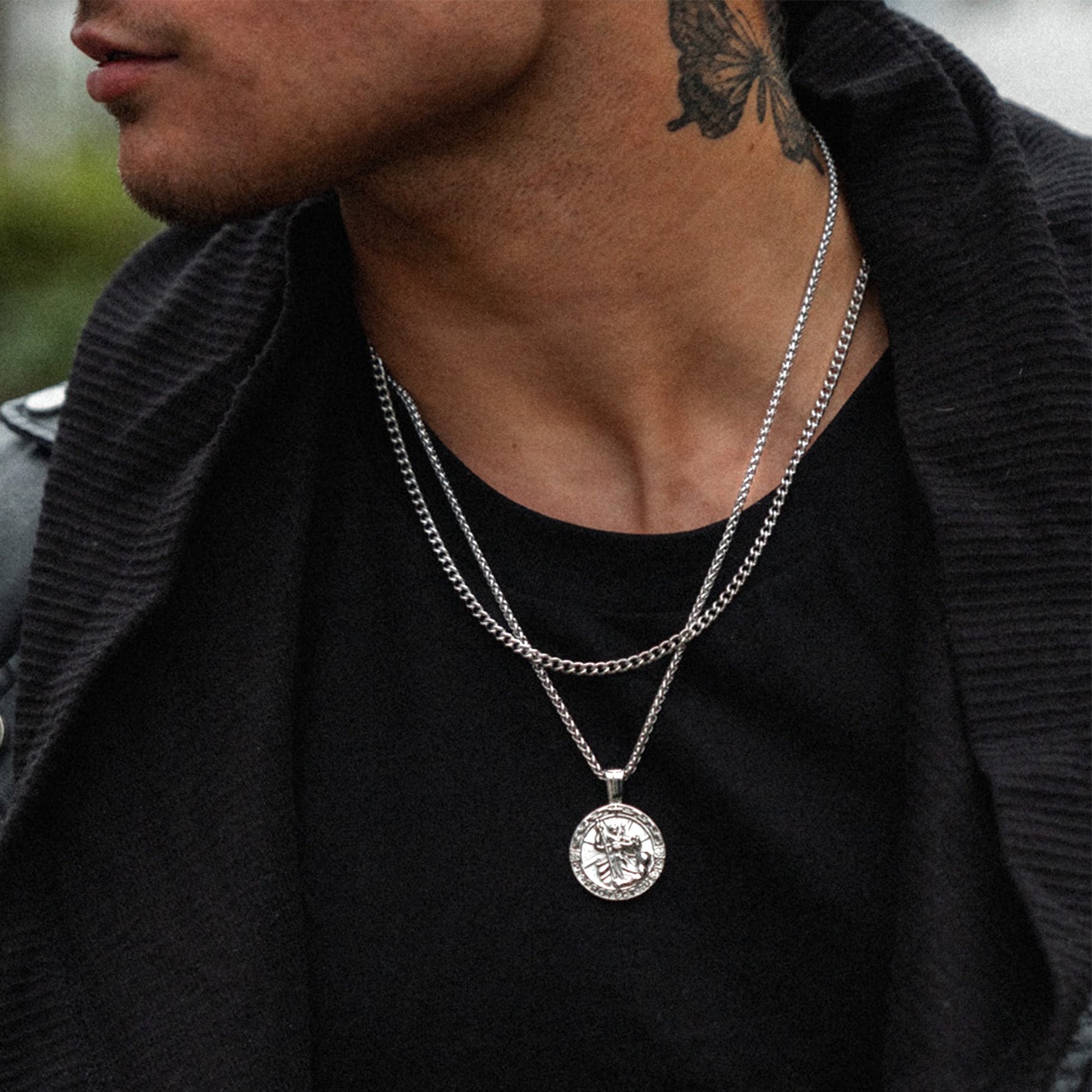 Men's silver cuban layering chain necklace on model