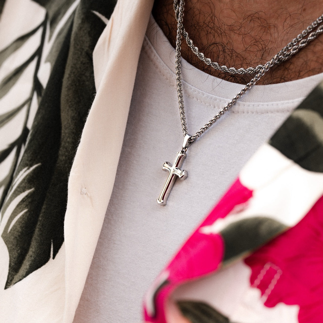 Mens silver stainless steel cross pendant with layering chain set on model