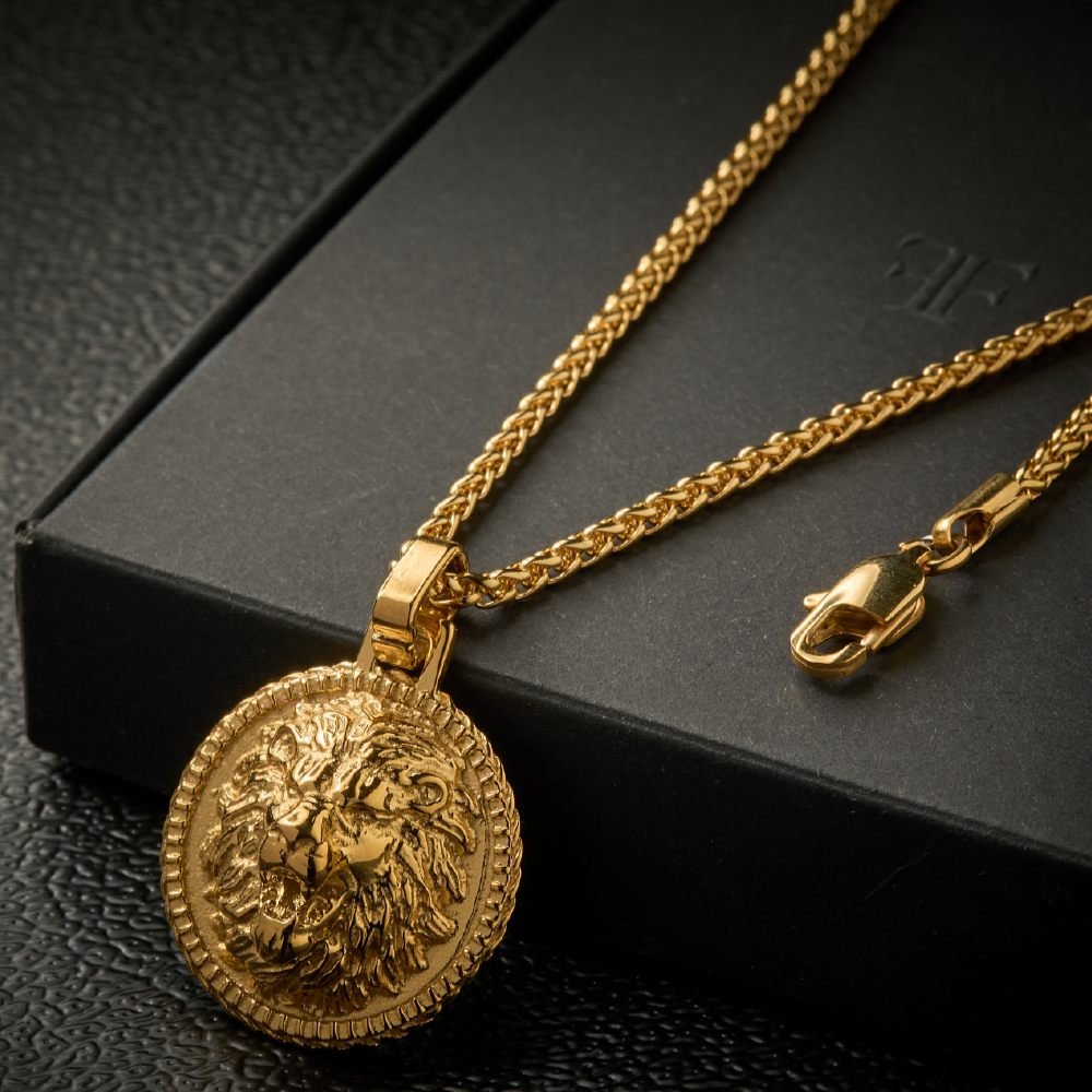 Men's gold plated lion pendant on black packaging