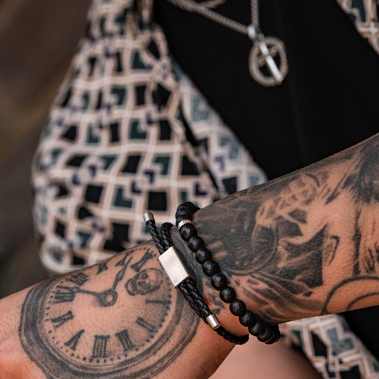 Men's faceted black onyx bead bracelet on model