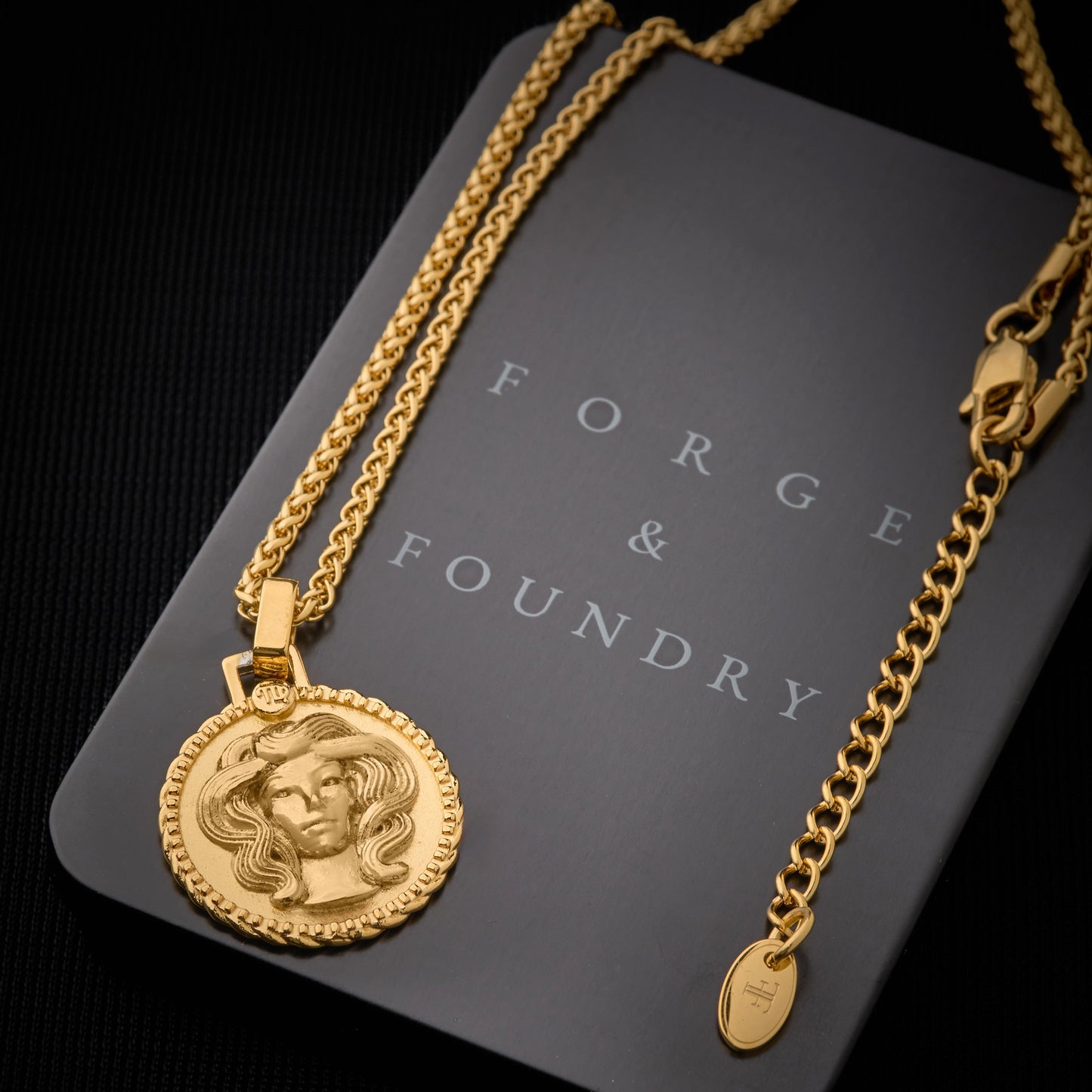 Men's gold Virgo necklace pendant on packaging box