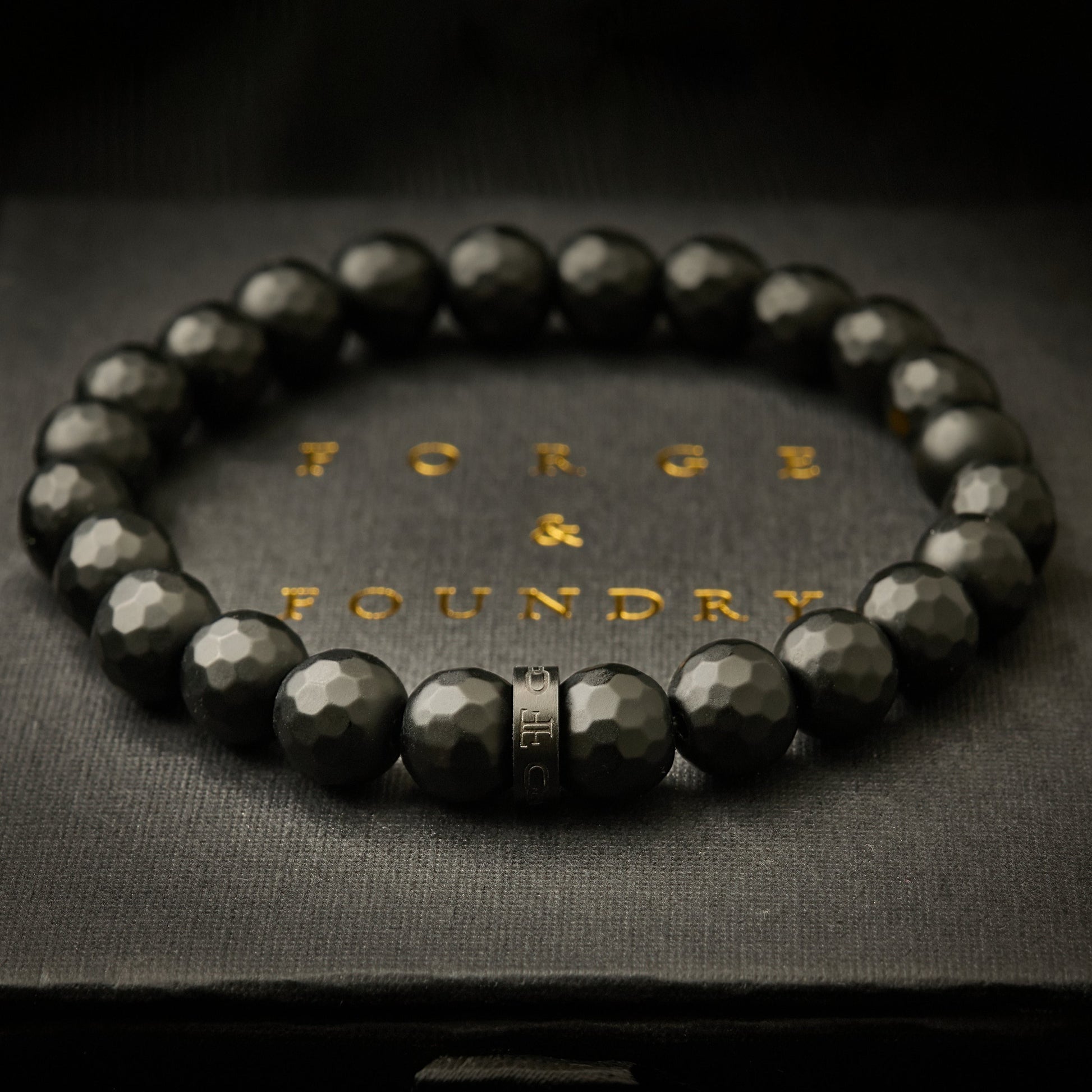 mens black faceted onyx bead stone bracelet on packaging