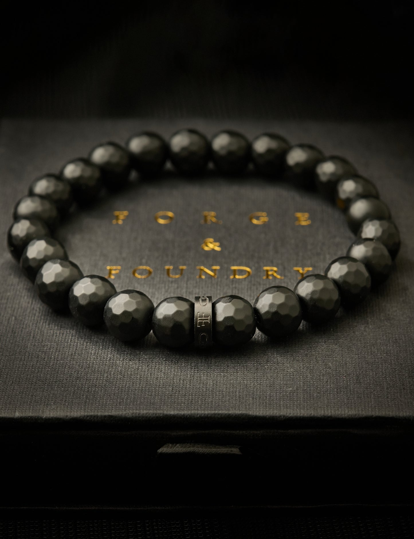 mens black faceted onyx bead stone bracelet on packaging