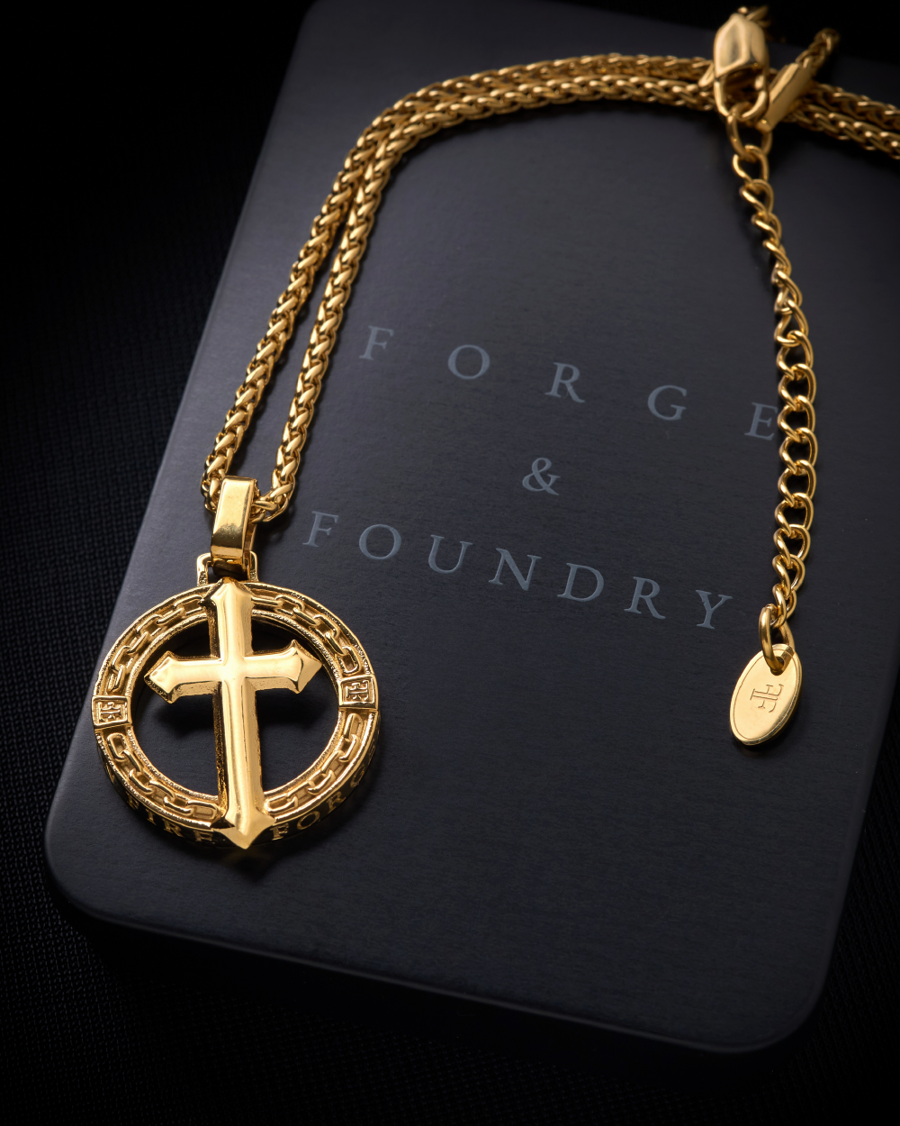Mens gold plated cross pendant on tin packaging