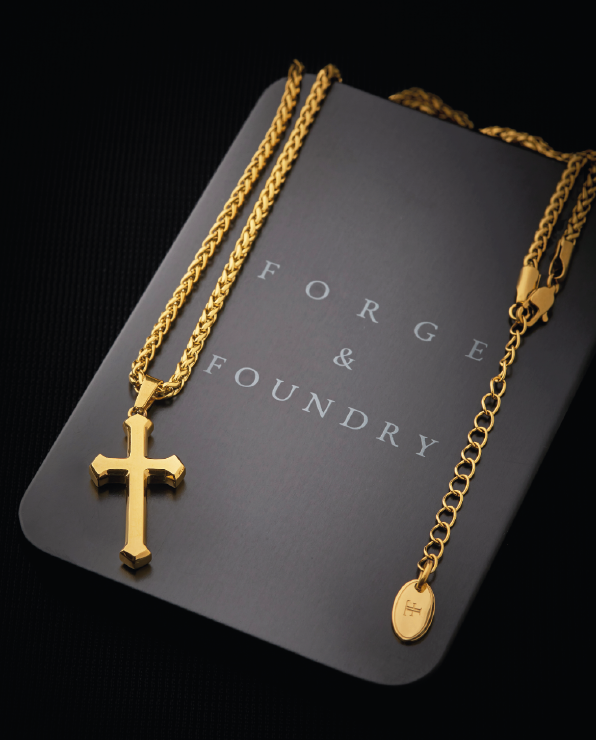 Mens gold palted simple cross pendant simplistic design on packaging tin
