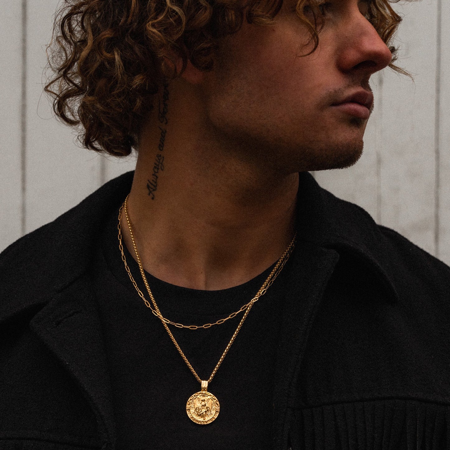 Men's gold paperclip layering necklace chain on model