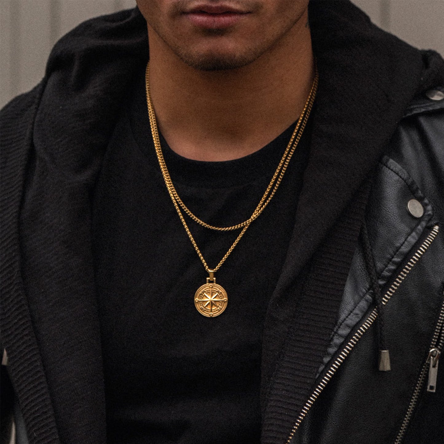 Men's gold cuban layering chain necklace on model