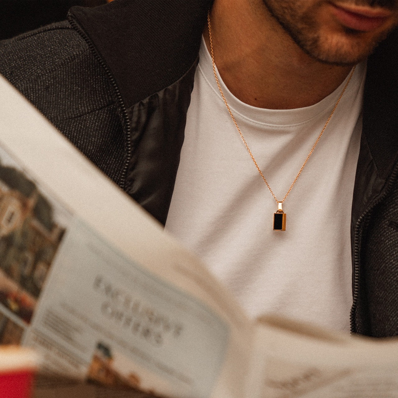 Men's gold onyx inlay pendant necklace on model