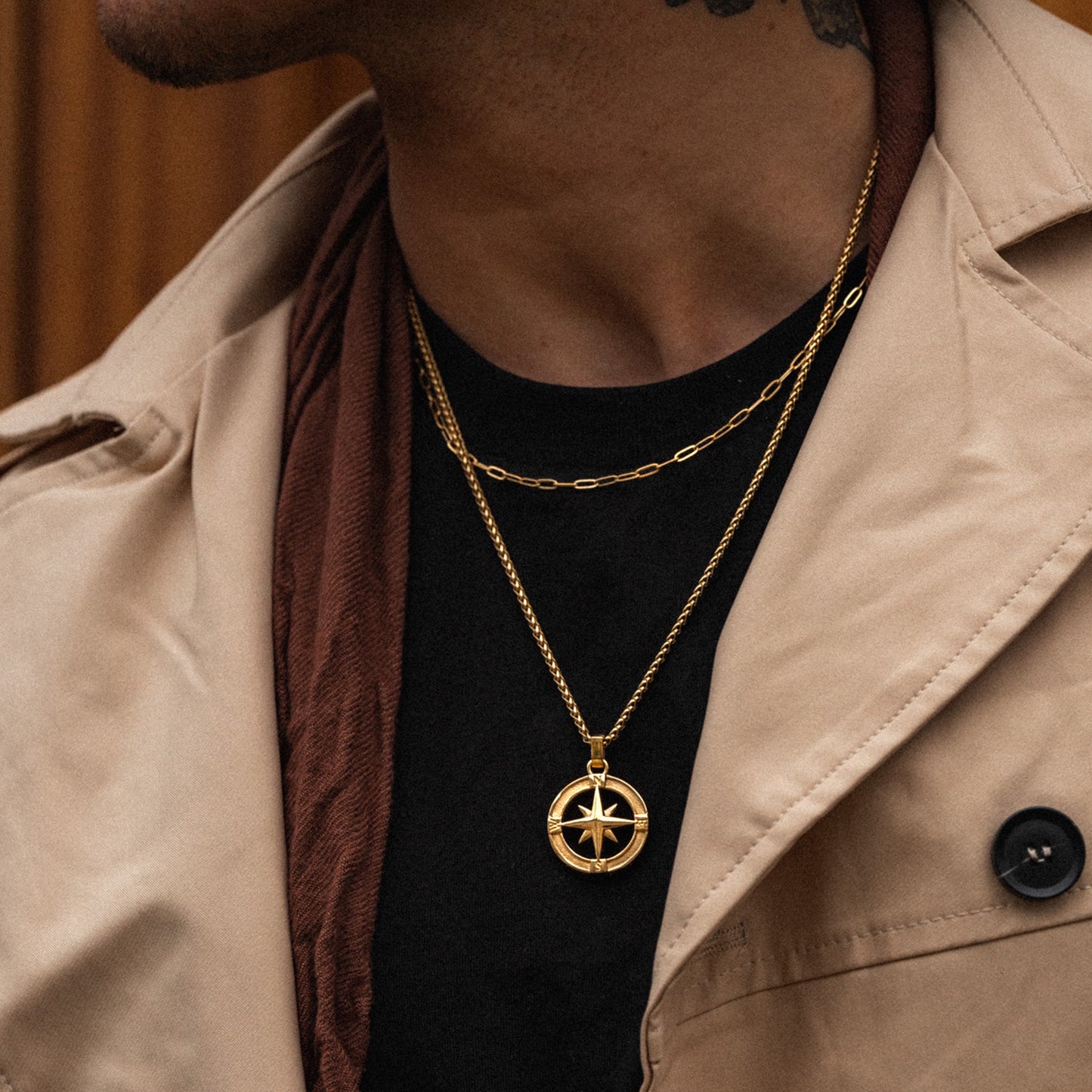 Men's gold paperclip layering necklace chain on model