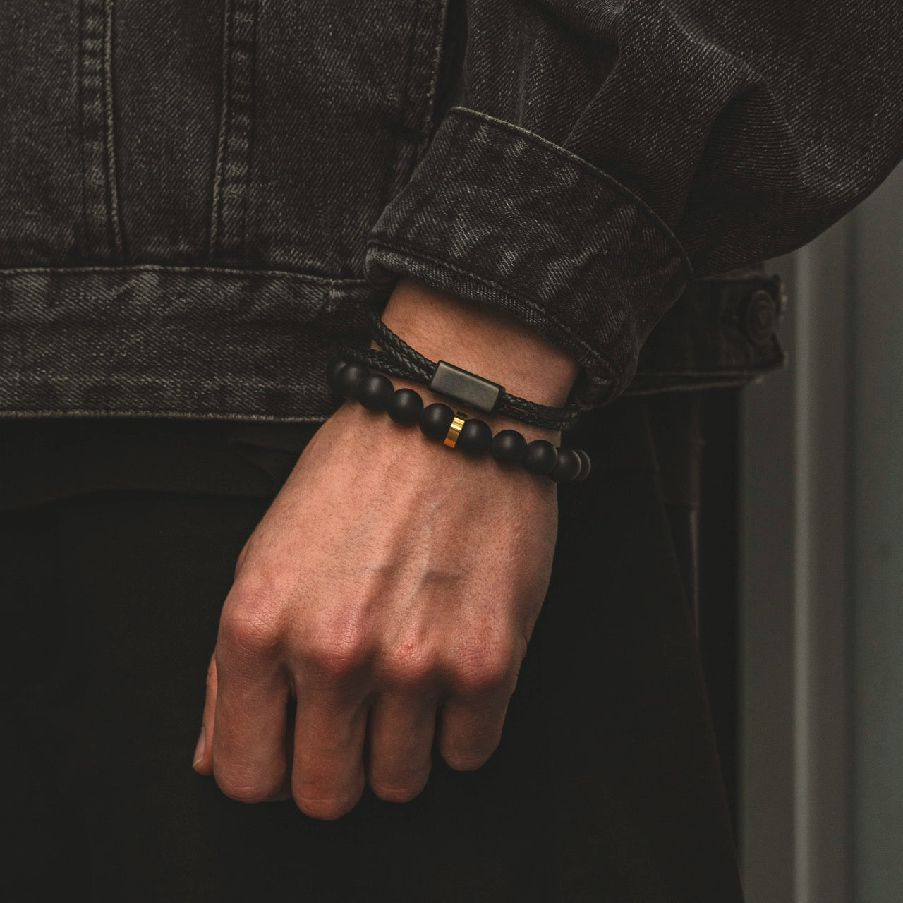 Men's adjustable 10mm onyx bead bracelet on model