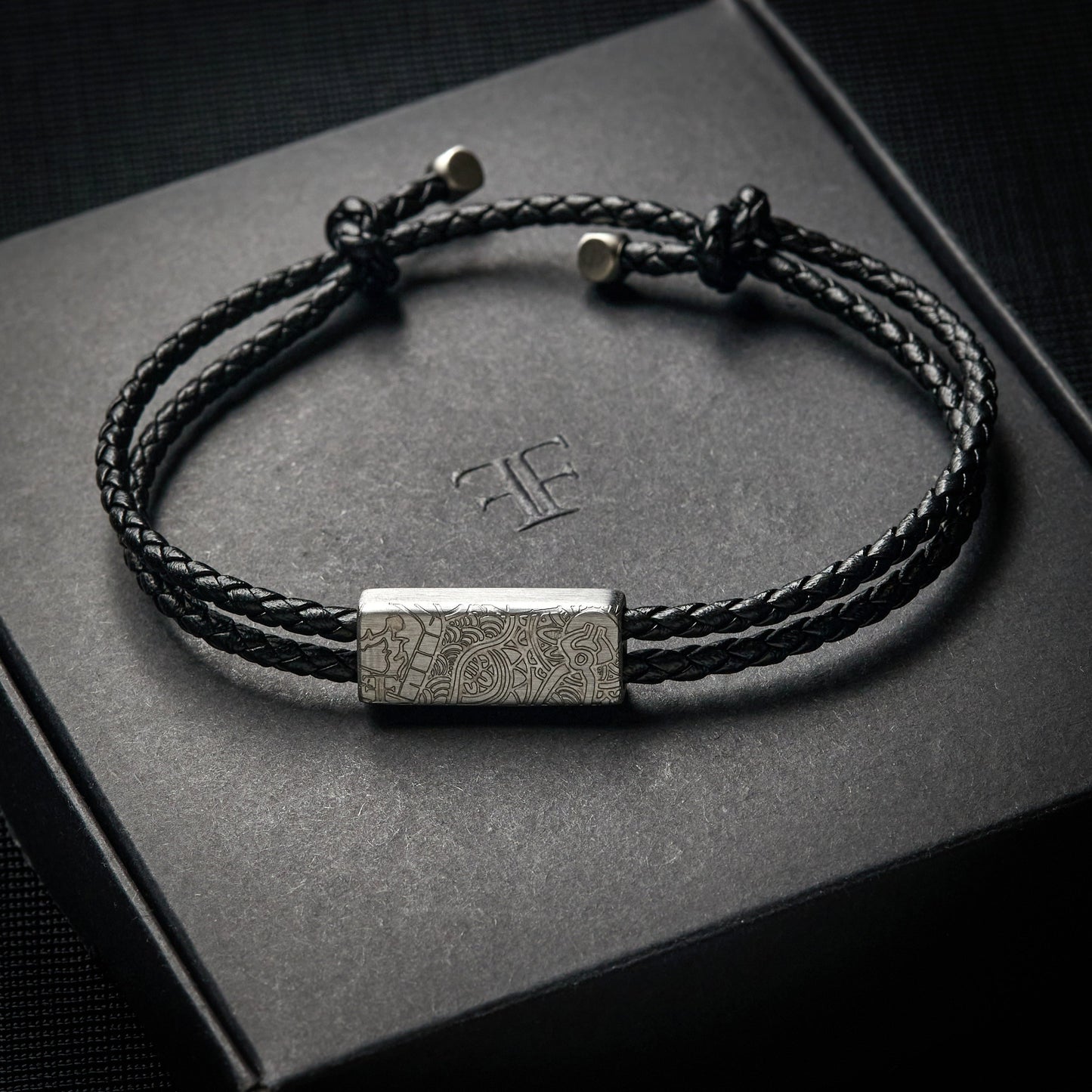 Men's silver etch clasp adjustable leather bracelet on packaging