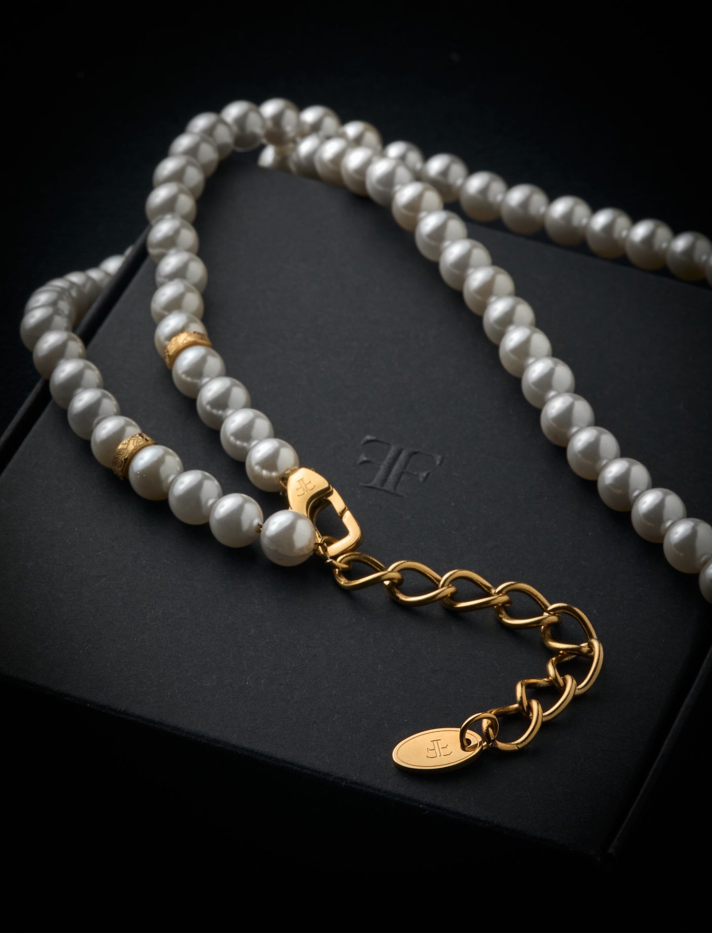 mens pearl necklace with gold beads on packaging